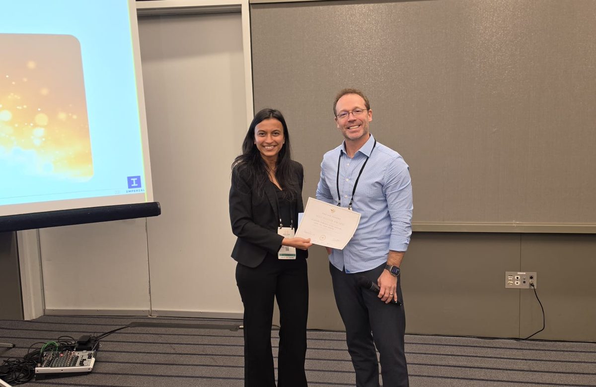 Naitri Rajyaguru receiving the Best Poster Award certificate at an IROS 2026 workshop